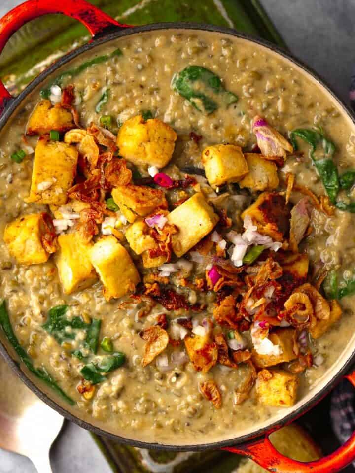 A pot of Ginisang Munggo with tofu and spinach.