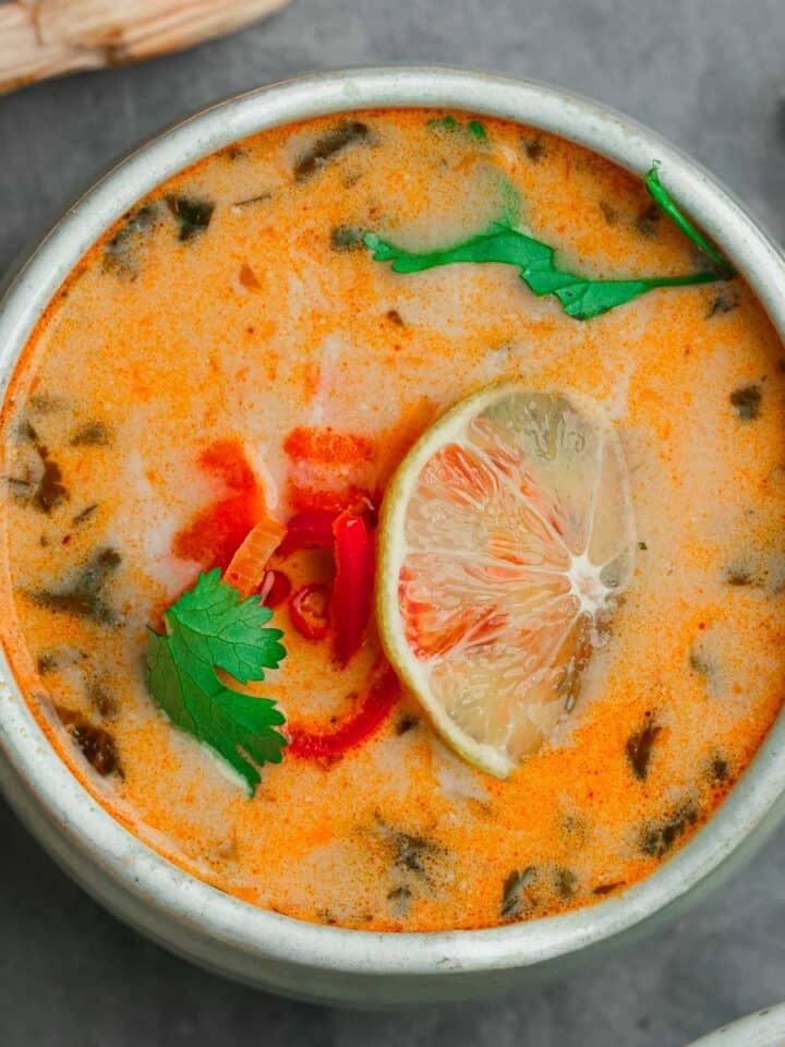 Thai curry soup in a bowl on a table.