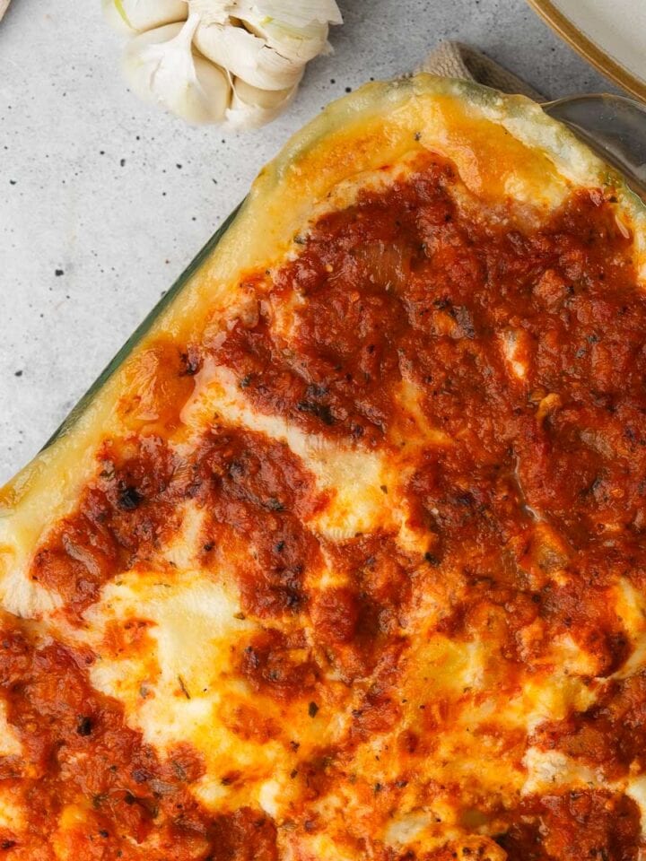 Baked zucchini boat filled with cheese and vegan baked ziti.